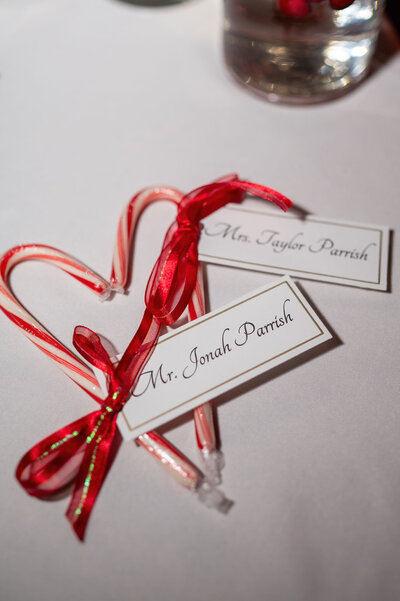 Candy cane wedding favors with name tags and ribbons