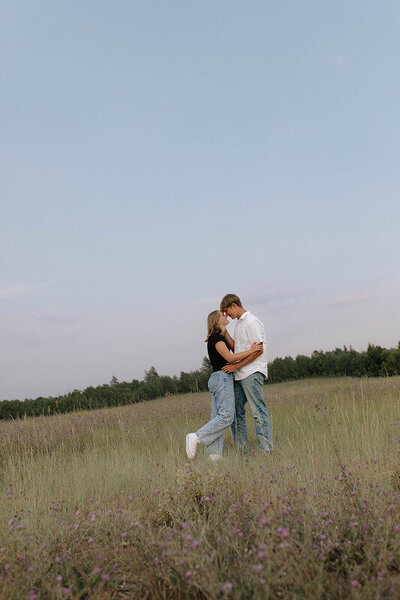 Outdoor couples photography in Idaho Falls, Idaho. A couple hold each other as they touch foreheads.