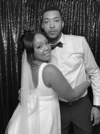 black and white photo of bride and groom in a glam photo booth at a Downingtown wedding