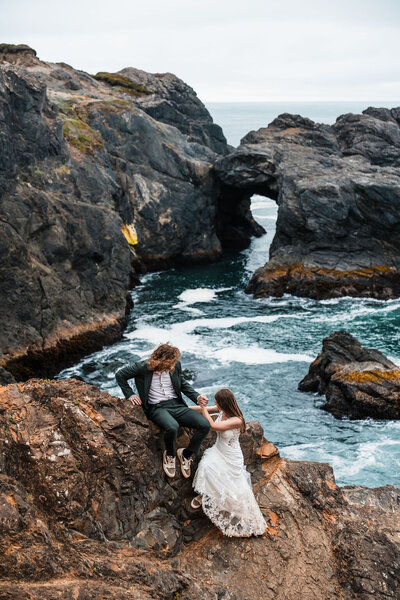 elopement couple hug one another at sunset cliffs elopement