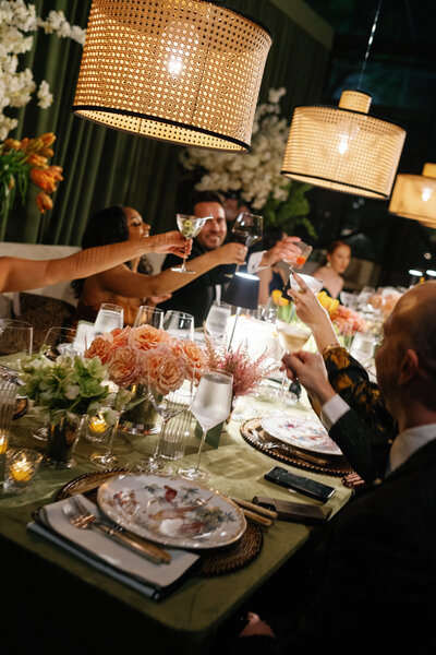 Wedding reception guests cheering