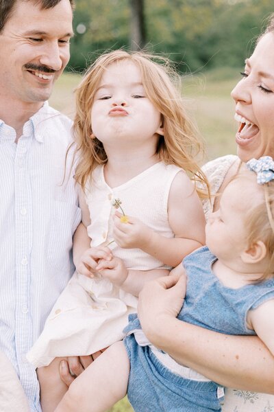 toddler laughing and being silly with family in peoria, illinois photos 