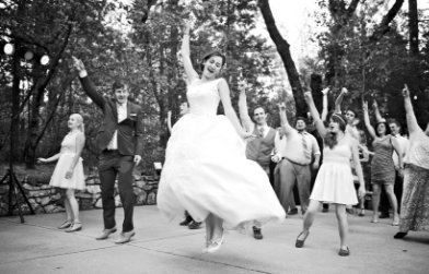 Grass Valley Wedding Fair bride jumping in air in wedding dress  at venue The Roth Estate Nevada City, Joy of Life Events wedding planner