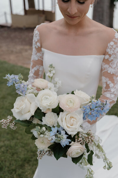 Beautiful Bride and Groom nuzzled together on their wedding day