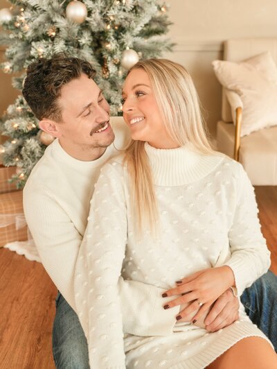 Styled Christmas photo setup at Evermore Place in Gray, Maine featuring a flocked tree and cozy seating