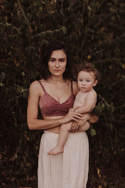 Photo of a mother holding a toddler child
