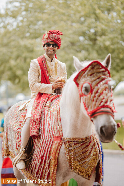 Indian groom riding on horse