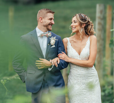 Bride and groom walking hand-in-hand at summer wedding | Bear Brook Valley Winery | Fredon Township, New Jersey