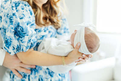 newborn baby girl swaddled