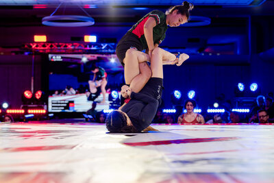Two women in leg lock entanglement at F2W