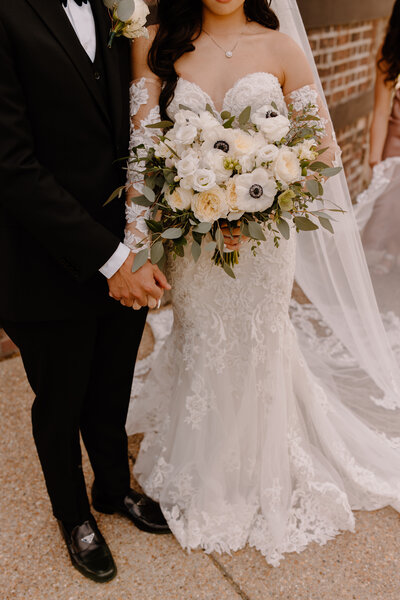 Bride and groom walk up memorial steps at their DC wedding