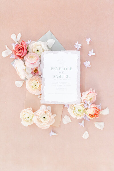 bright light and airy wedding photo of bridal details flowers invitation wedding
