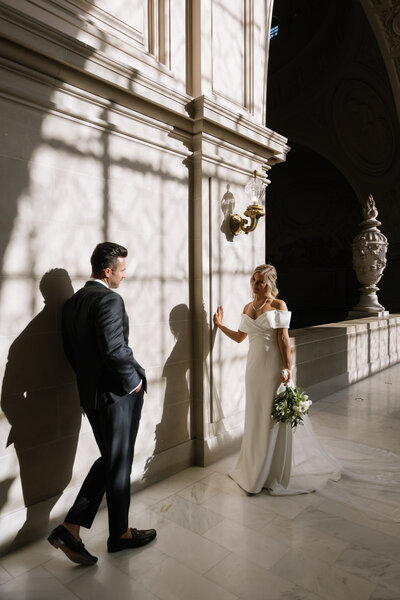Joyful couple embracing during their wedding at San Francisco City Hall, captured by MVF Portraits
