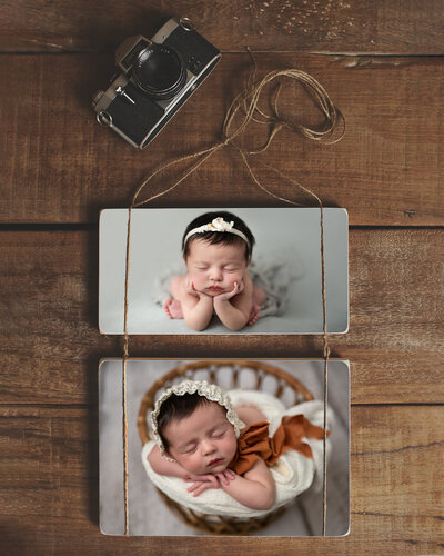 two photoblocks with newborn girl images hanging
