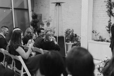 Guests seated during intimate rooftop wedding ceremony at Quirk Hotel Richmond, captured in natural, documentary style.