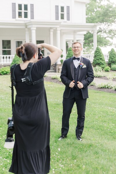 Ephe photographs a groomsman at John Joseph Inn.