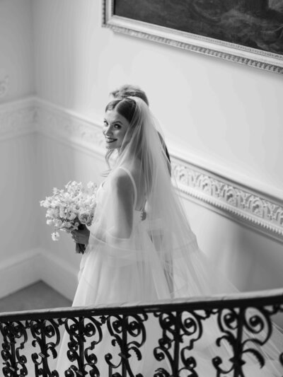 Bride walking down stairs at Came House Wedding Venue