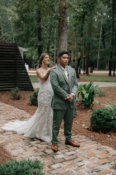Bride and groom during first look at Pineland Place a Charleston SC wedding