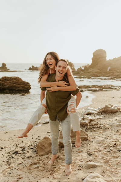 Couple laughing on the beach in Newport Beach, California