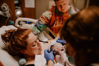 Crying mom birthing her baby in an El Paso Hospital