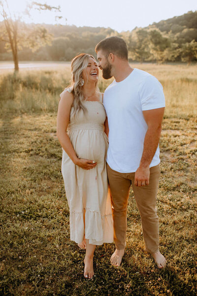 pregnant woman and husband outside