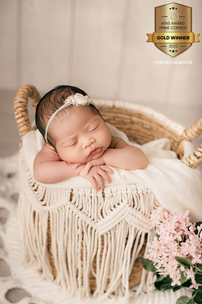 AFNS Award winning Toronto Newborn Photographer, Newborn girl asleep in a macrame basket in studio.