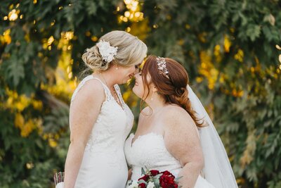 two brides kissing on their wedding day  in fresno  CA