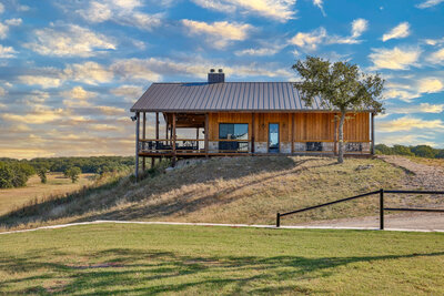 white kitchen with granite countertops  in Big beautiful home for sale in Lindsay Texas with a dreamy inground pool