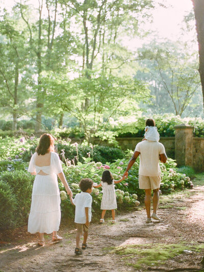 family walks into glowing sunlight by huntsville photographers fauna & film
