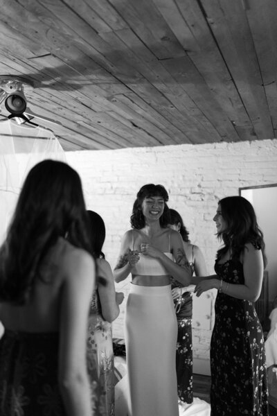 A Bride getting dressed for her wedding day with her closest friends