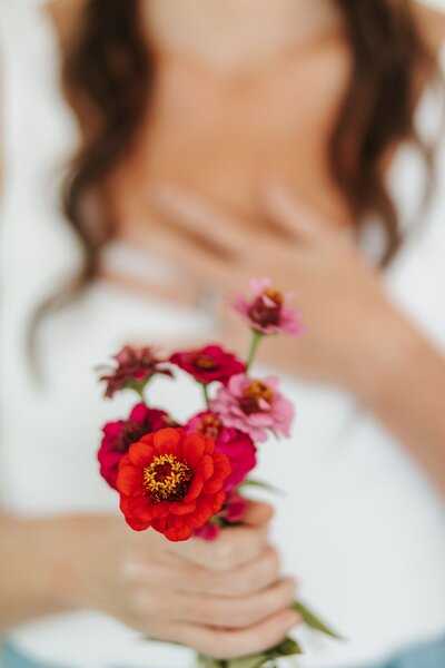 Elizabeth holding flowers in hand