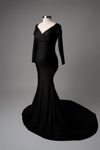 Form-fitting off-shoulder black dress with structured waist detail