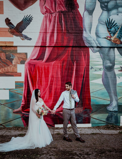 Bride and groom at the Smogshoppe LA venue looking at one another smiling as they dance their first dance