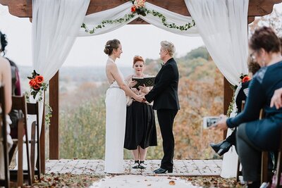 two brides getting married on a hilltop overlooking the mountains of Tennessee