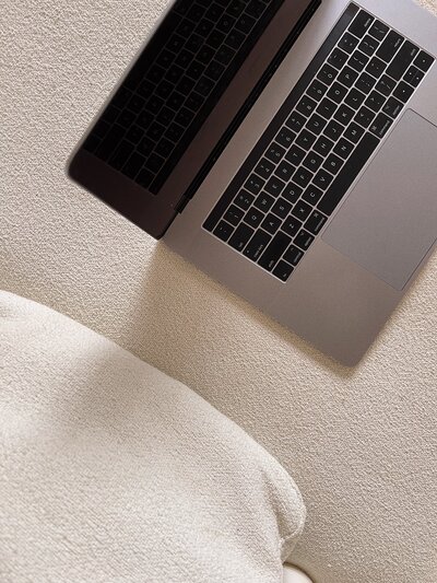 close up of laptop on white couch