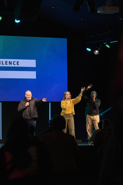 Group of people worshipping at a non-denominational church in Fayetteville, NC. 