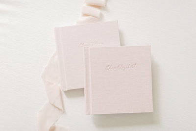 photo of 2 beautiful blush pink baby albums made by Madison WI photographer Talia Laird Photography