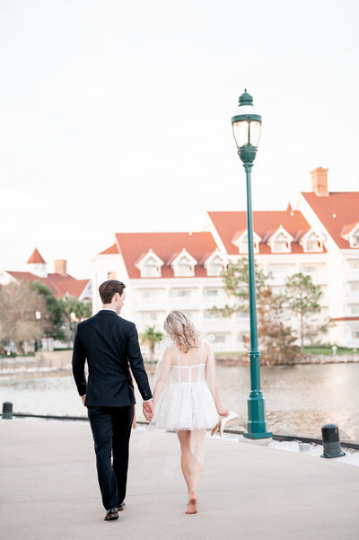 bride holding blush and white bridal bouquet