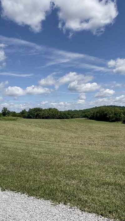 Outdoor ceremony site and cocktail hour pasture field at Willstone Acres wedding venue