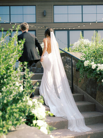 bride and groom leave wedding ceremony at tetherow resort wedding