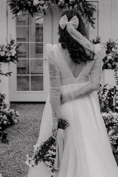  A beautifully captured vintage-style wedding moment of a bride, featuring soft tones and timeless romance in Spokane, Washington.