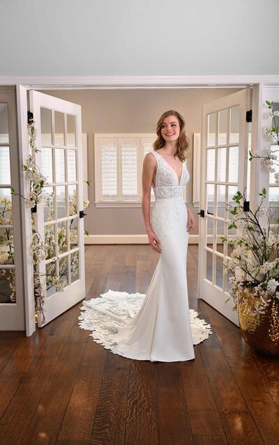 FLORAL FIT-AND-FLARE WEDDING GOWN WITH STRAPLESS BODICE For romantic garden glamour, look no further than Style D3044 from Essense of Australia! Showered in richy, leafy laces embedded with shimmer, the organic detailing creates vine-like patterns throughout the silhouette that are absolutely extraordinary. The modern, strapless neckline features slight peaks along the bust and a delicate plunge, with the laces reaching ever so slightly above the trim for a natural finish. The bodice is fully constructed and features a higher back, fortifying the silhouette with added support. The flare of the skirt flows out from just above the knees, with each layer of gathered tulle featuring pops of lace appliqués adding dimension. The unfinished hem creates a frothy effect at the base of the gown to maintain its lightweight look and feel. This gown is also available in plus sizes.