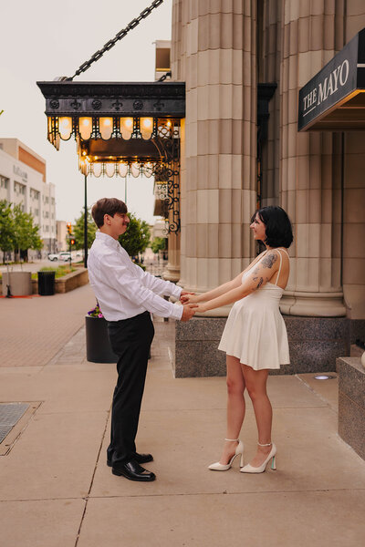 couple holding hands in dallas for engagement photos