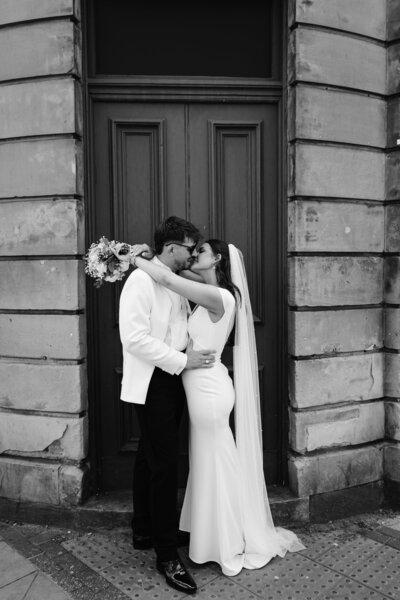 Bride and Groom outside venue at Leeds City wedding, alternative chic city wedding