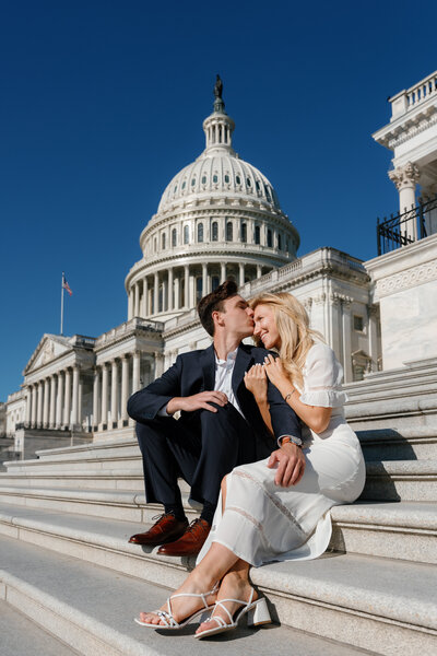 A person kissing their partner's head