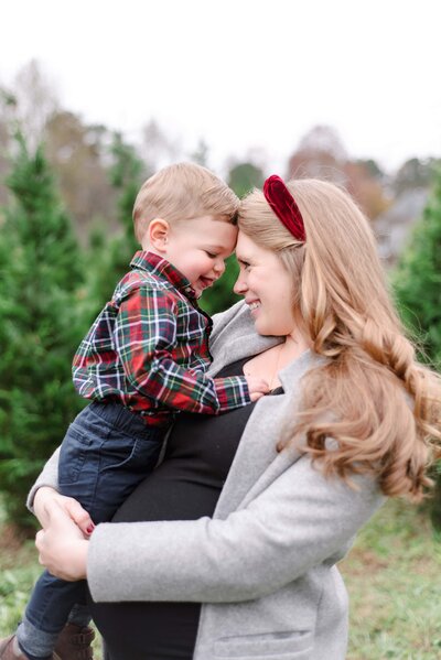 A touching moment between a mom and her son at aThompson Tree Farm Family Session.