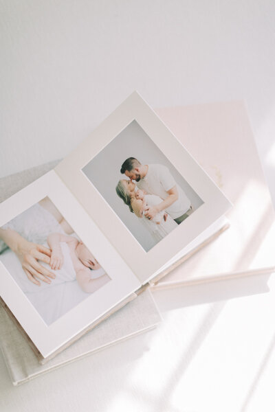 matted newborn album in blush pink linen cover by milwaukee photographer Talia Laird Photography