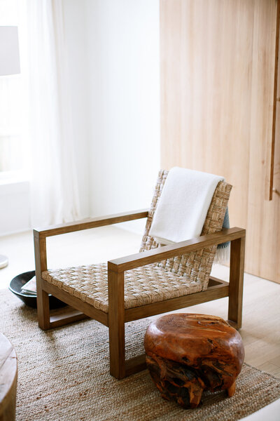 Cozy rattan armchair in a modern, sunlit Port Moody living space.