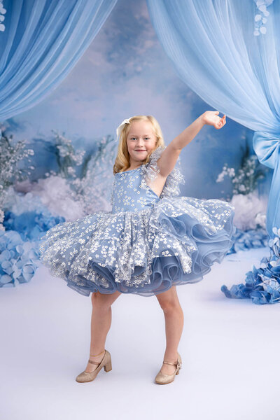 Child wearing Bentley and Lace gown during styled session in La Vernia
