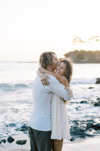 couple hugging on a rooftop